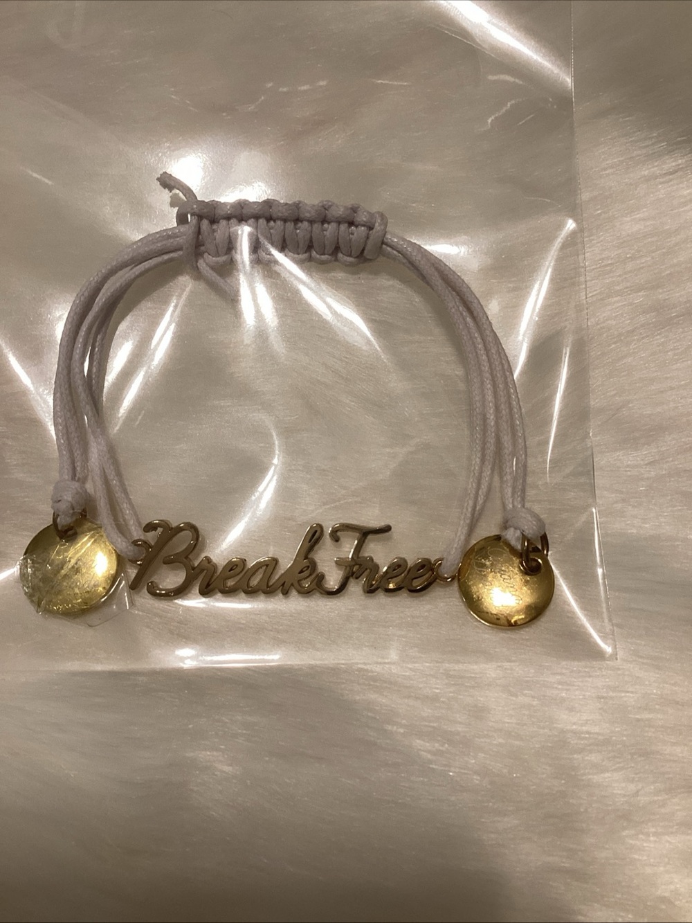 Ariana Grande Break Free,Gold Script Charm Bracelet - White Cord